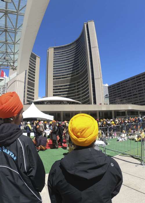 Toronto , Canada- April 30, 2018: Between 85,000 and 100,000 revellers lined Toronto’s streets on Sunday, marching to City Hall in tribute to the Sikh new year
